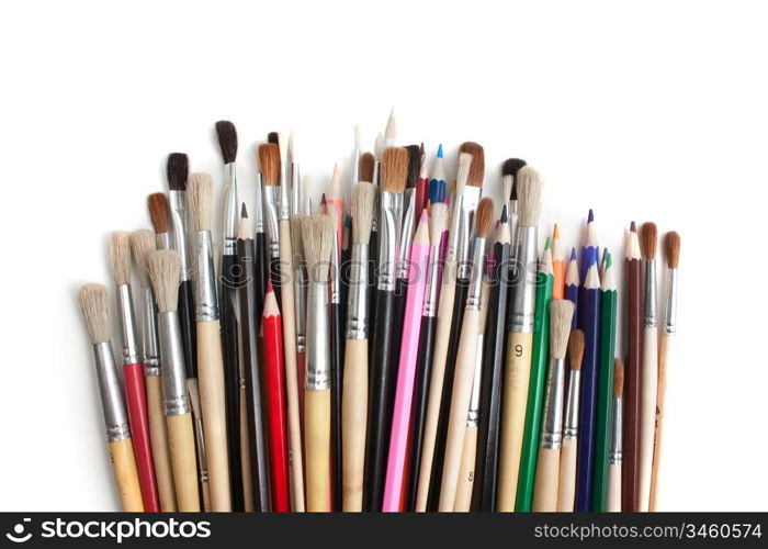 color pencils and brushes isolated on a white background