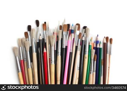 color pencils and brushes isolated on a white background