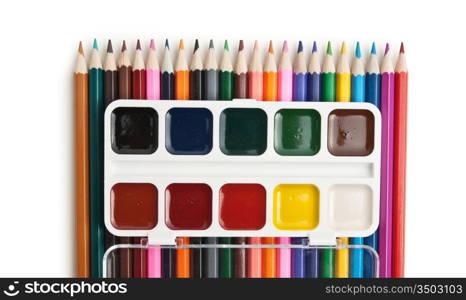 color pencils and watercolor paints isolated on a white background