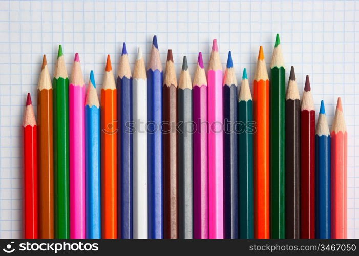 color pencils at school notebook