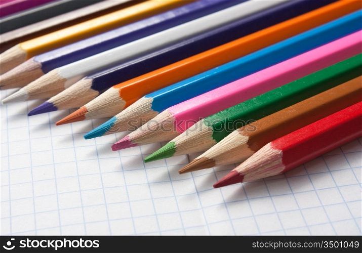 color pencils at school notebook