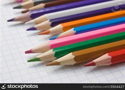 color pencils at school notebook
