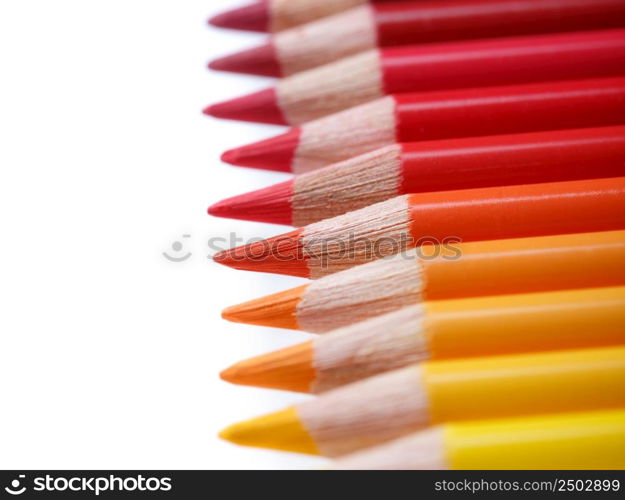 Color pencils in a row, isolated on white, shallow dof