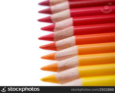 Color pencils in a row, isolated on white, shallow dof
