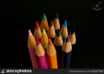 Color pencils isolated on black