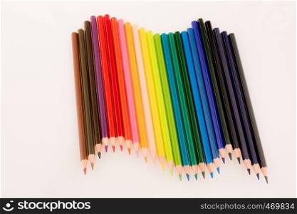 Color pencils of various color on a white background