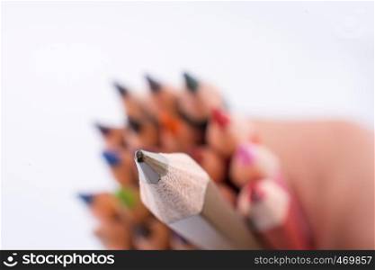 color pencils of various colors on a white background