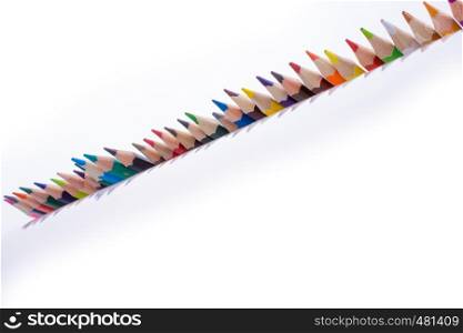 Color Pencils of various colors on a white background