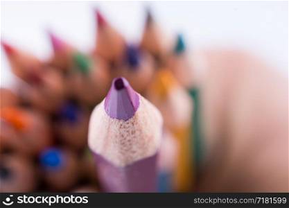 color pencils of various colors on a white background