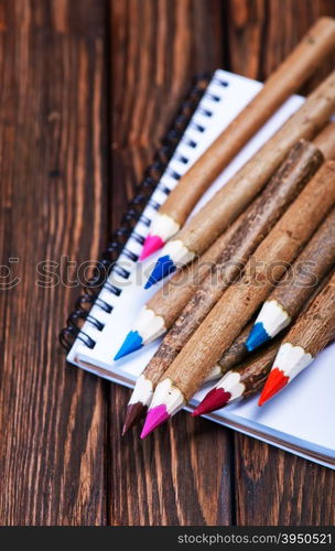 color pencils on the wooden table, pencils on a table