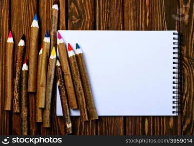 color pencils on the wooden table, pencils on a table