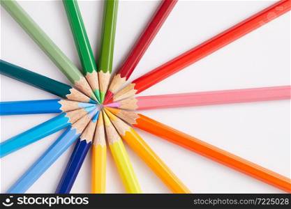 Color pencils on white background, copy space.. Color pencils on white background.