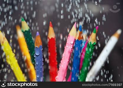 Color pencils under the rain. Close-up view