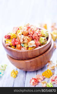 color popcorn in bowls and on a table