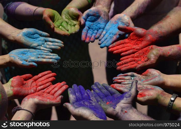 Color powder on hands during holi festival near Pune, Maharashtra