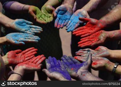 Color powder on hands during holi festival near Pune, Maharashtra