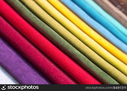 Color s&les of the upholstery fabric in the assortment. palette of fabrics of various colors. Colored tissue s&les