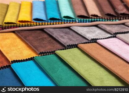 Color samples of the upholstery fabric in the assortment. palette of fabrics of various colors. Colored tissue samples