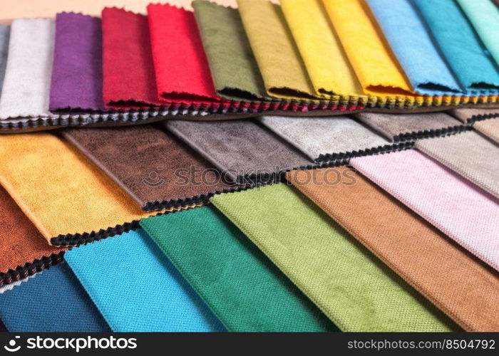 Color samples of the upholstery fabric in the assortment. palette of fabrics of various colors. Colored tissue samples