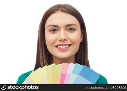 color scheme, decoration, design and people concept - smiling young woman with color swatches or samples