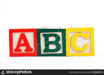 Color wooden alphabet blocks isolated on white