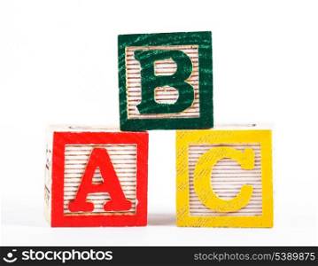 Color wooden alphabet blocks isolated on white