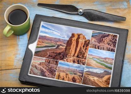 Colorado River canyon and 4wd trail at Chicken Corner in the Moab area, Utah - reviewing aerial pictures on a tablet with a cup of coffee, all screen images copyright by the photographer