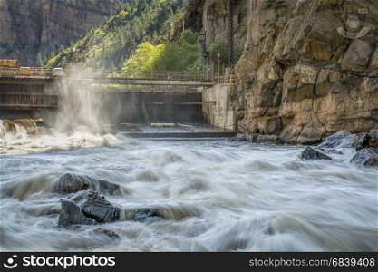 Colorado River flowing from an open gate of Shoshone Power Plant in Glenwood Canyon