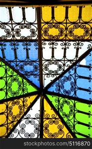 colorated glass and sun in morocco africa window and light