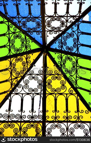 colorated glass and sun in morocco africa window and light