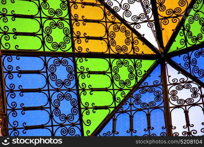 colorated glass and sun in morocco africa window and light