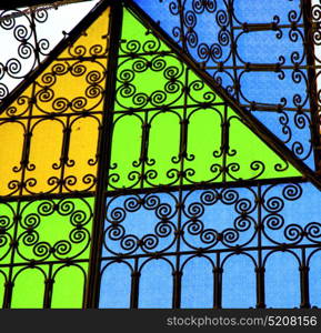 colorated glass and sun in morocco africa window and light