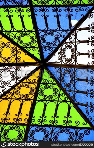 colorated glass and sun in morocco africa window and light