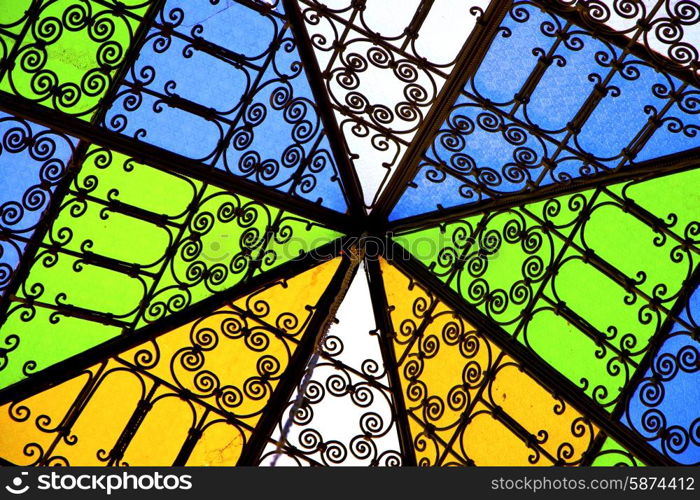 colorated glass and sun in morocco africa window and light