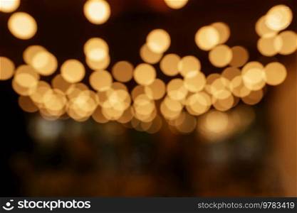 colored blurred bokeh christmas garlands on dark background