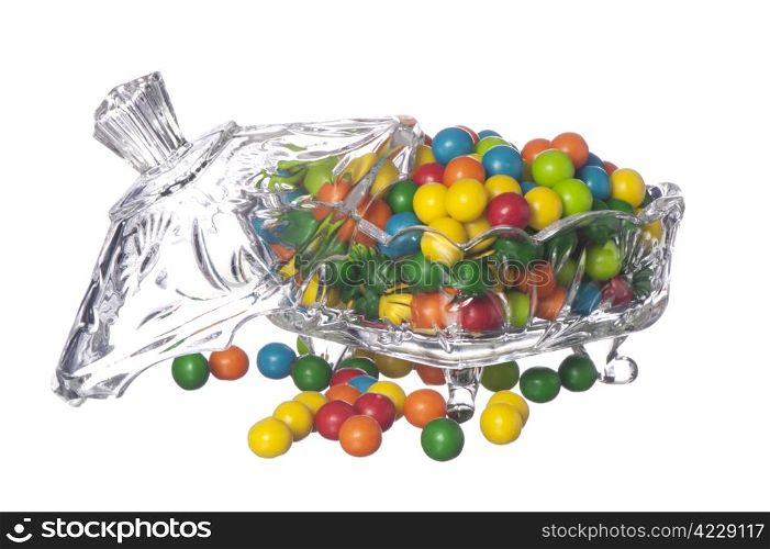 colored candy in a container of crystal on a white background