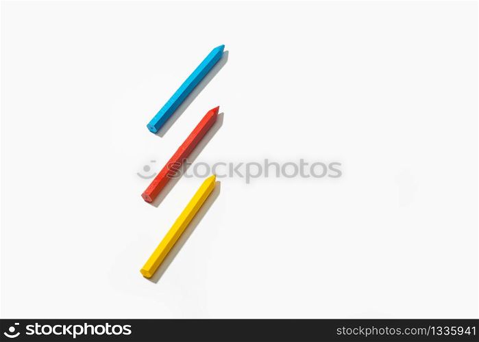 Colored crayons isolated on white background. Copy space for text. Back to school concept
