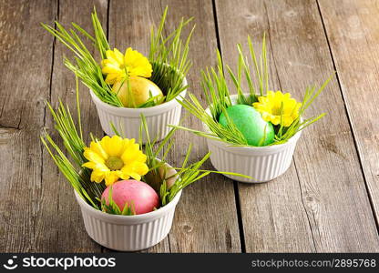 Colored easter eggs on wooden table