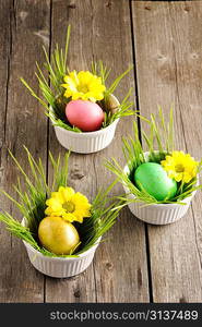 Colored easter eggs on wooden table