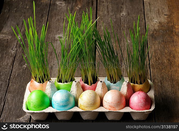 Colored easter eggs on wooden table