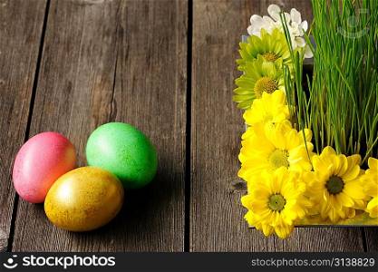 Colored easter eggs on wooden table