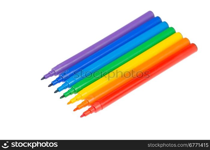 Colored felt pens lie in a row, isolated on white background, studio shot, field, top view