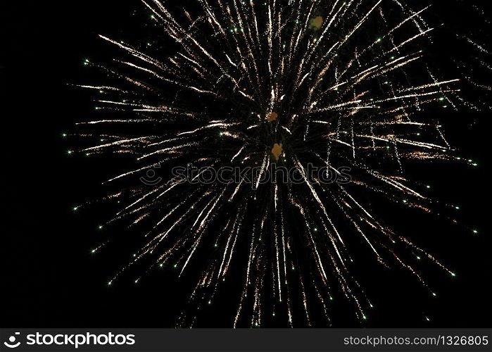colored Fireworks on Deep Black Background Sky on Fireworks festival show before independence day on fourth of July or new year. Real colored Fireworks on Deep Black Background Sky on Fireworks festival show before independence day on 4 of July