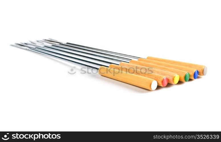 colored fondue forks isolated on white