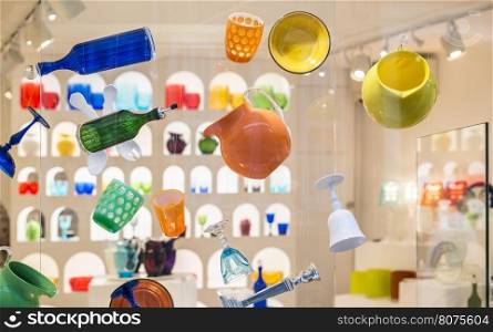 Colored glass cups on showcase