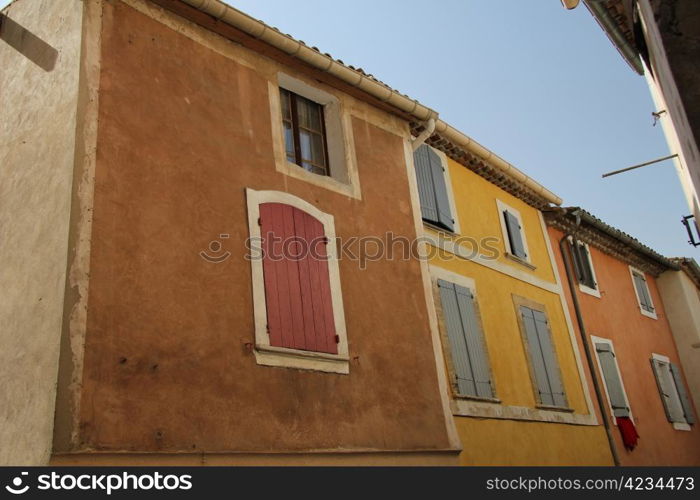 Colored houses with plastered facades in Bedoin, France