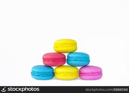 Colored macarons lined up on top of each other in white background