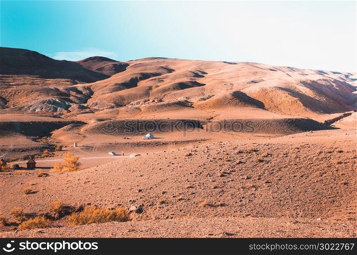 Colored mountains under the blue sky. Red hills of Kyzyl-Chin, Altai. Martian landscape. Red canyon.