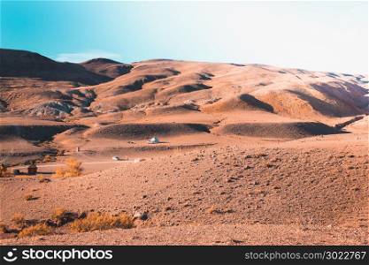 Colored mountains under the blue sky. Red hills of Kyzyl-Chin, Altai. Martian landscape. Red canyon.