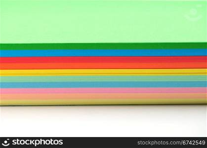 Colored paper stack on white background